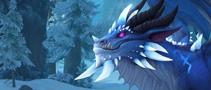 A large blue dragon stands in front of a frosted ice environment.